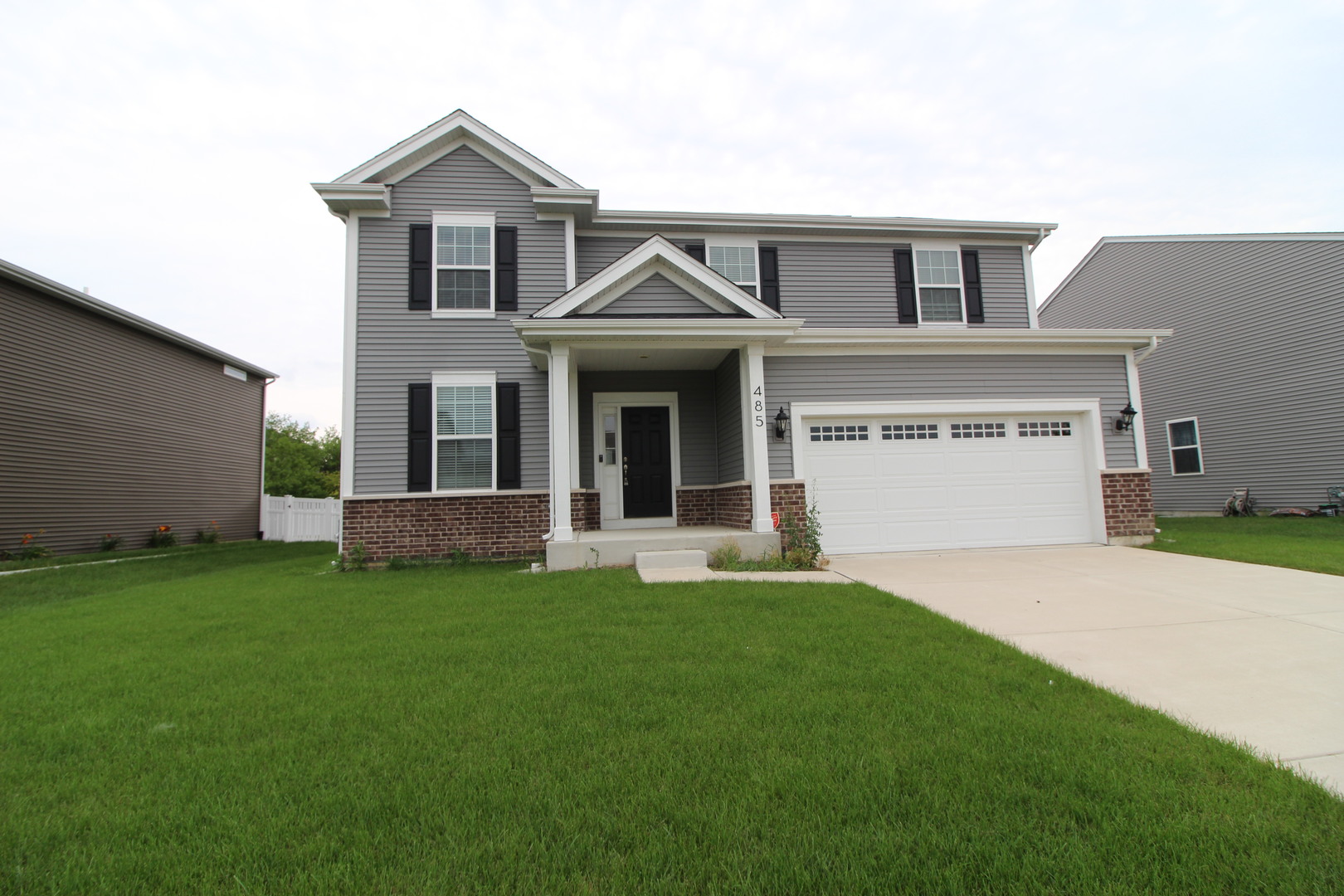 front view of a house with a yard