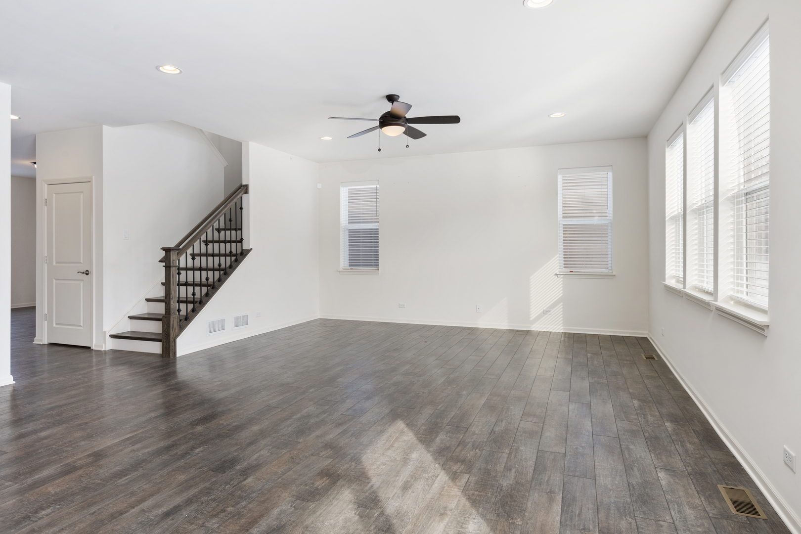 485 Stone Bluff Drive Romeoville, IL 60446 - Photo 13 of 35 wooden floor in an empty room with a window