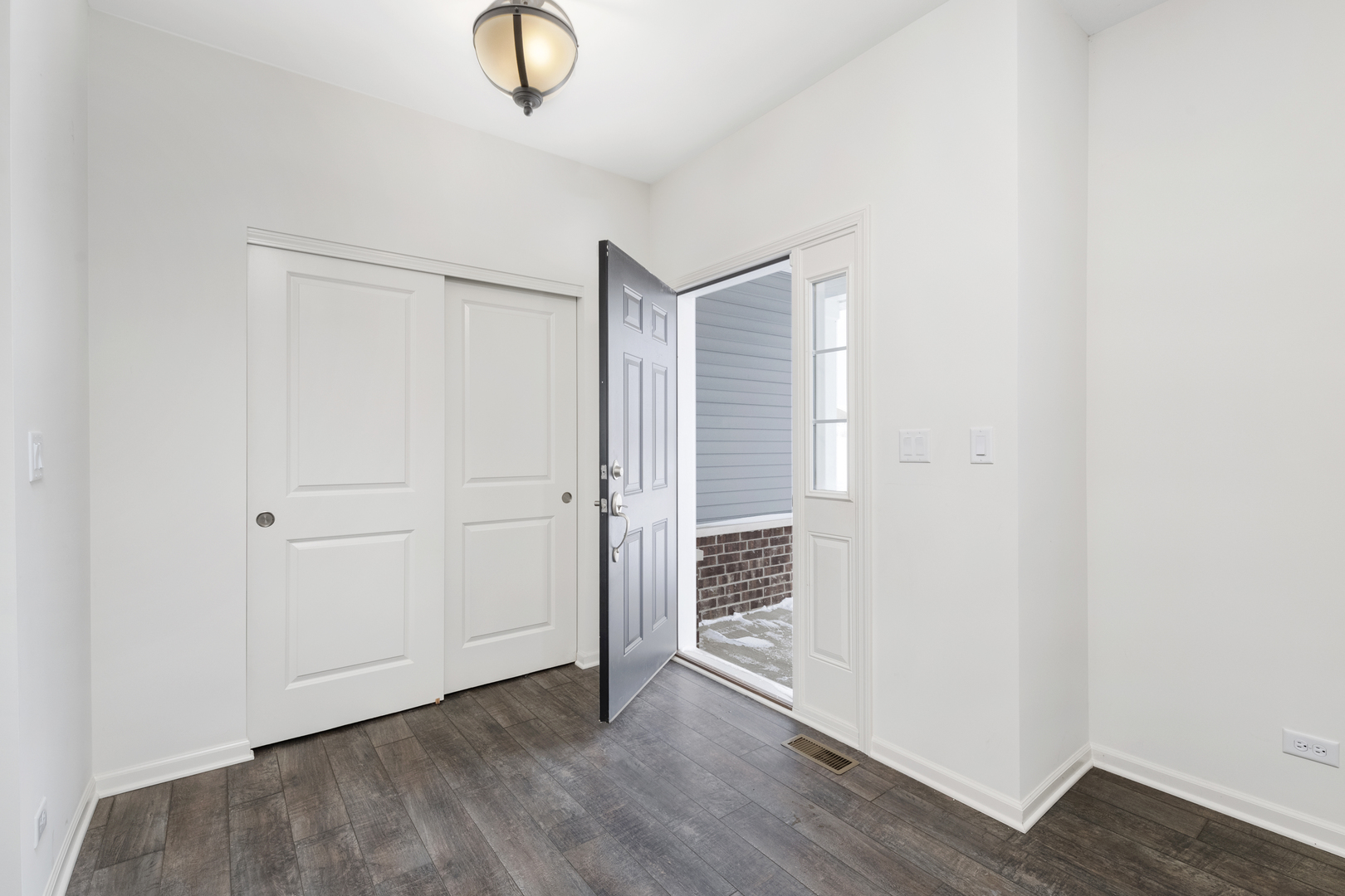 485 Stone Bluff Drive Romeoville, IL 60446 - Photo 3 of 35 an entryway of a room with wooden floor