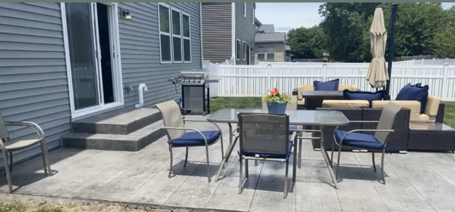 485 Stone Bluff Drive Romeoville, IL 60446 - Photo 31 of 35 a view of a patio with a table and chairs