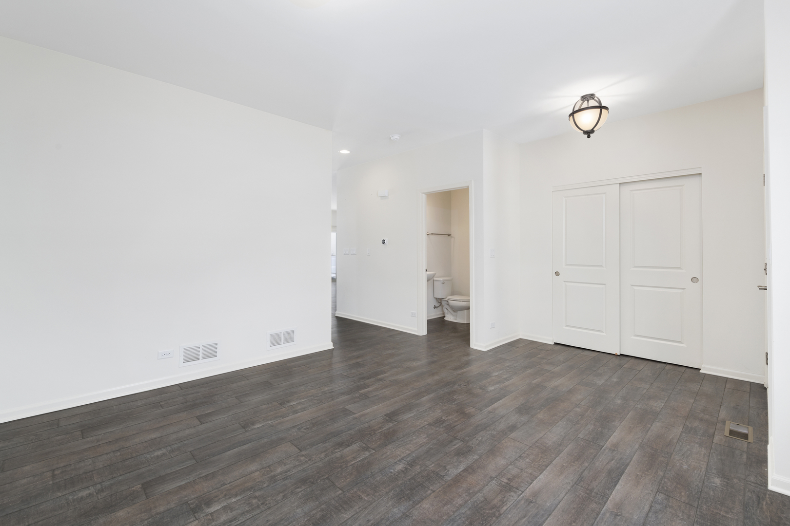 485 Stone Bluff Drive Romeoville, IL 60446 - Photo 5 of 35 a view of an empty room with wooden floor
