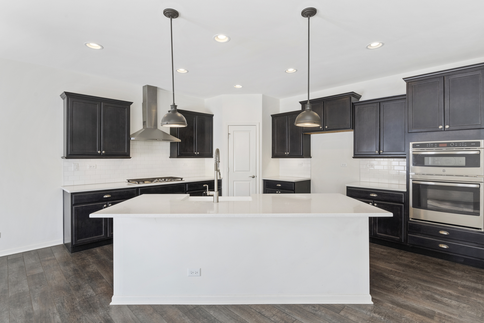 485 Stone Bluff Drive Romeoville, IL 60446 - Photo 6 of 35 a kitchen with stainless steel appliances kitchen island a sink stove and refrigerator