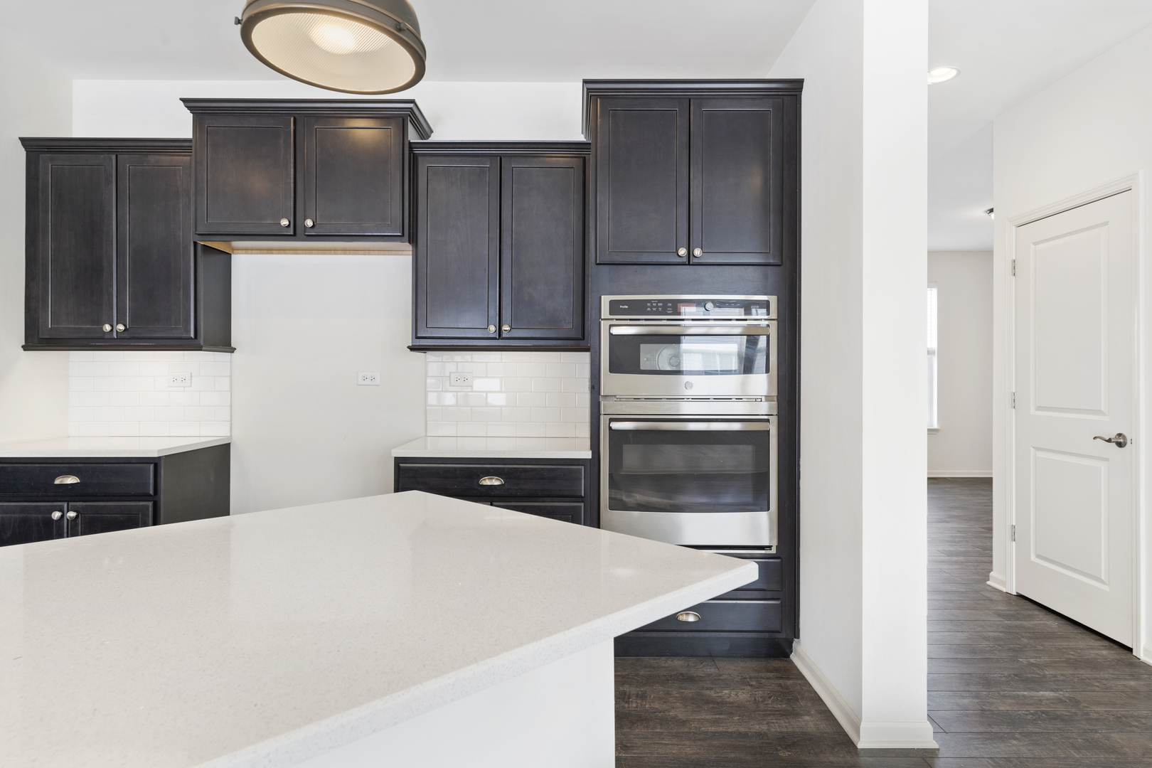 485 Stone Bluff Drive Romeoville, IL 60446 - Photo 7 of 35 a kitchen with a refrigerator and a stove