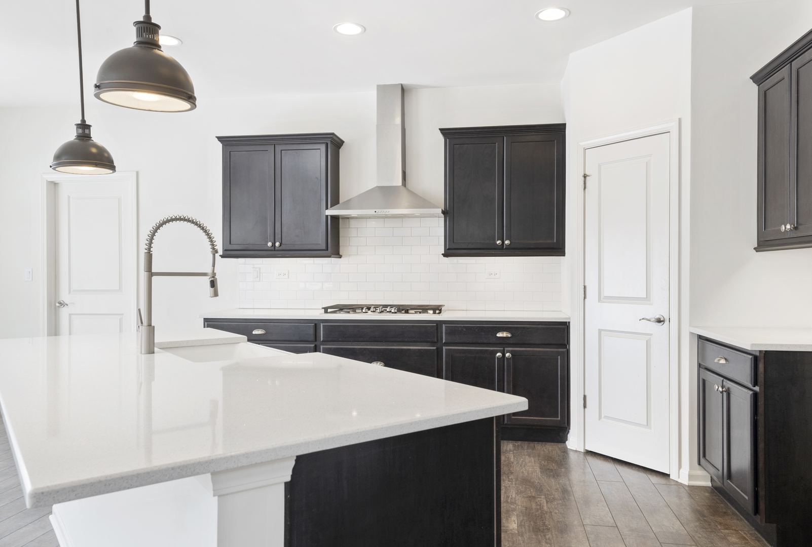 485 Stone Bluff Drive Romeoville, IL 60446 - Photo 8 of 35 a kitchen with stainless steel appliances a sink a stove a refrigerator and cabinets