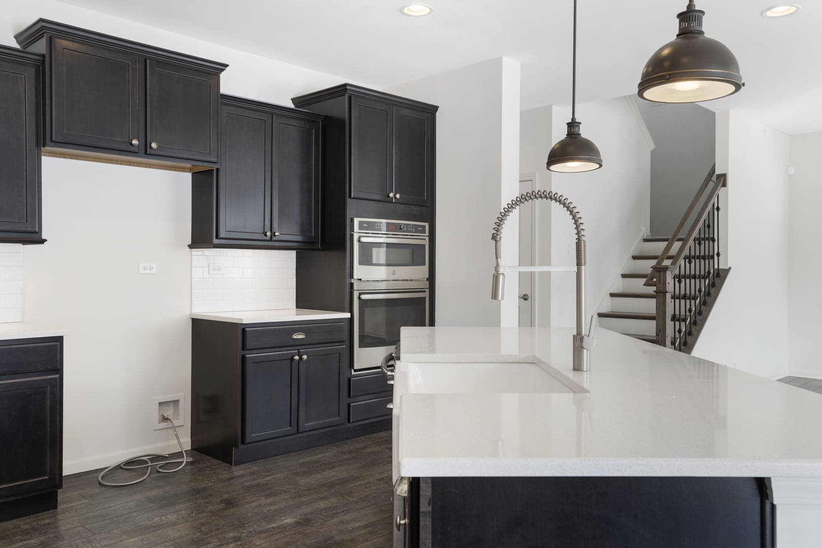 485 Stone Bluff Drive Romeoville, IL 60446 - Photo 10 of 35 a kitchen with stainless steel appliances a refrigerator and a stove top oven