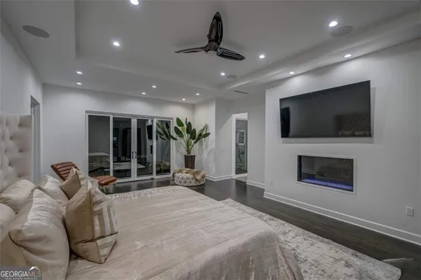 a living room with furniture tv and a fireplace