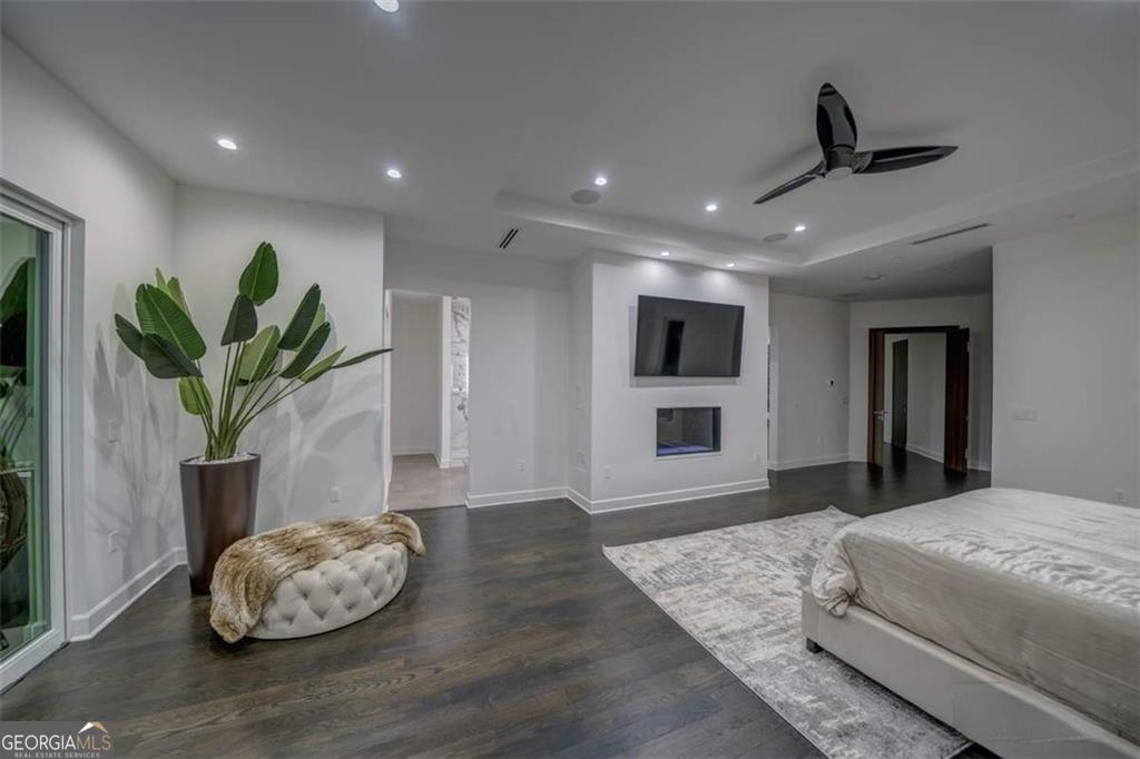 55 Serendipity Way Atlanta, GA 30350 - Photo 16 of 23 a bedroom with a bed and a potted plant