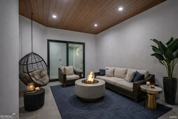 a living room with furniture and a potted plant