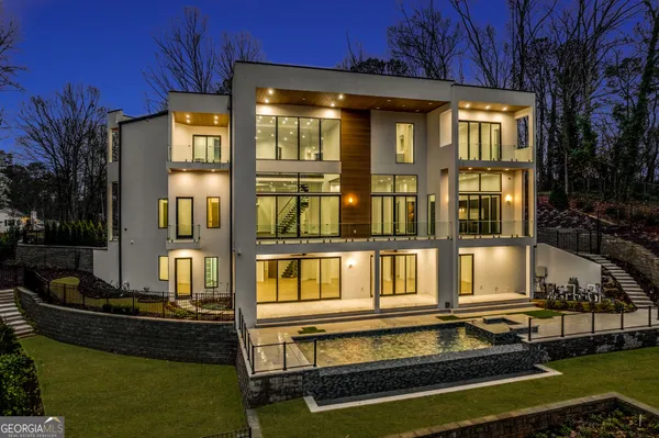 a front view of a house with a swimming pool