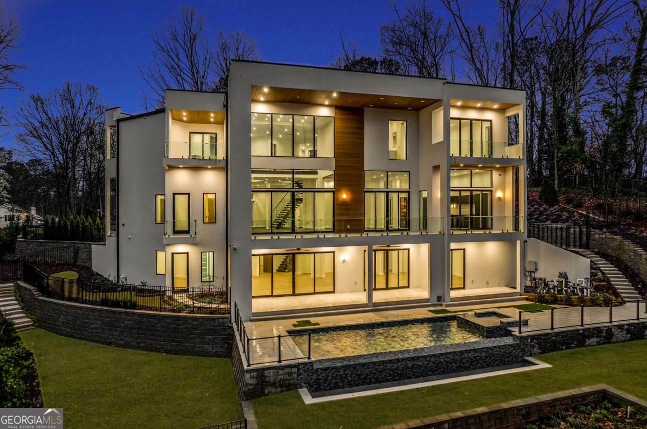 55 Serendipity Way Atlanta, GA 30350 - Photo 2 of 23 a front view of a house with a swimming pool