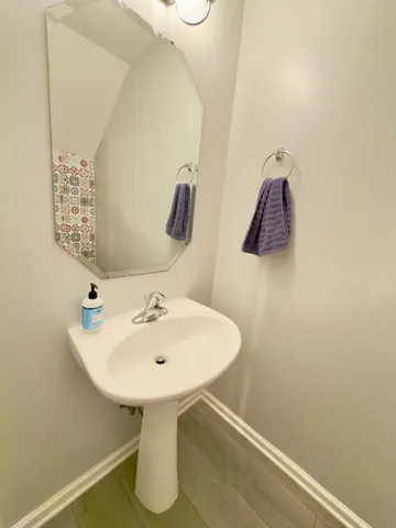 a white toilet sitting next to a small bathroom