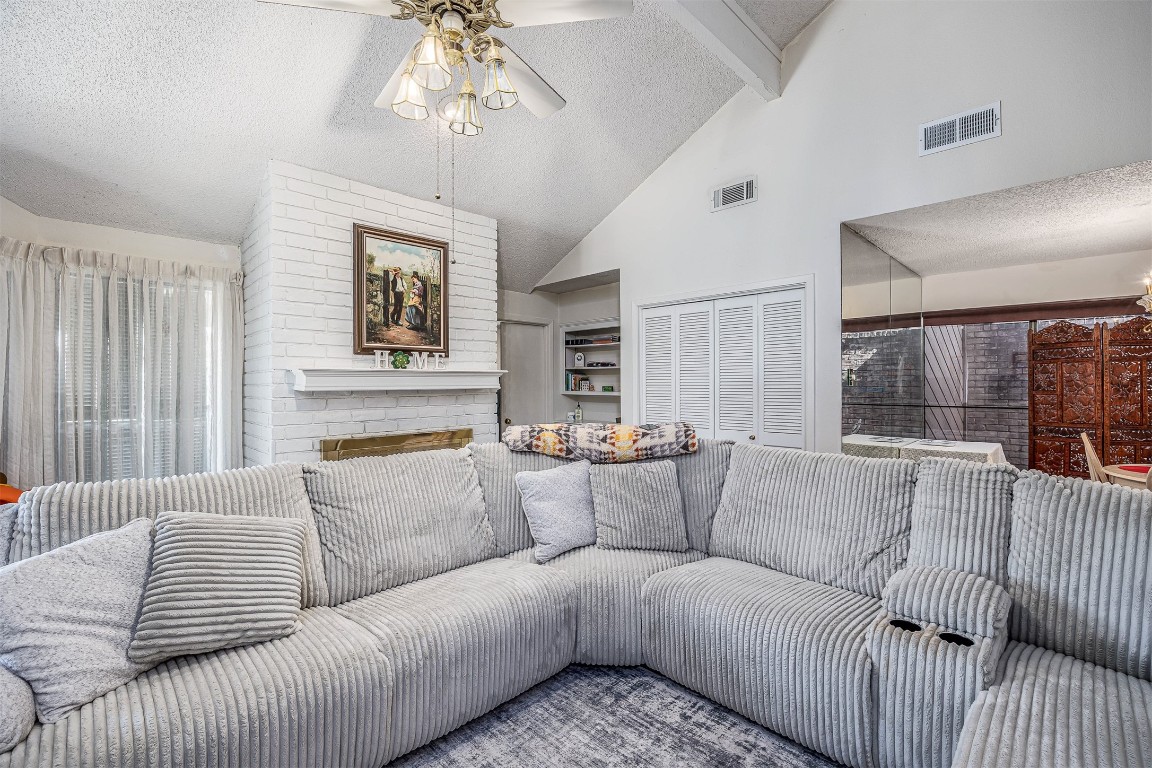 4613 Country Club View Baytown, TX 77521 - Photo 12 of 38 a living room with furniture and a chandelier