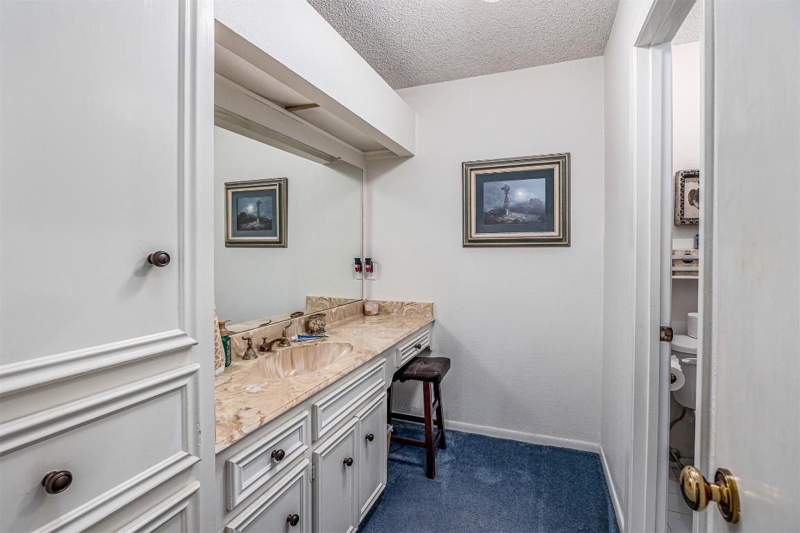 4613 Country Club View Baytown, TX 77521 - Photo 15 of 38 a bathroom with a sink and a mirror