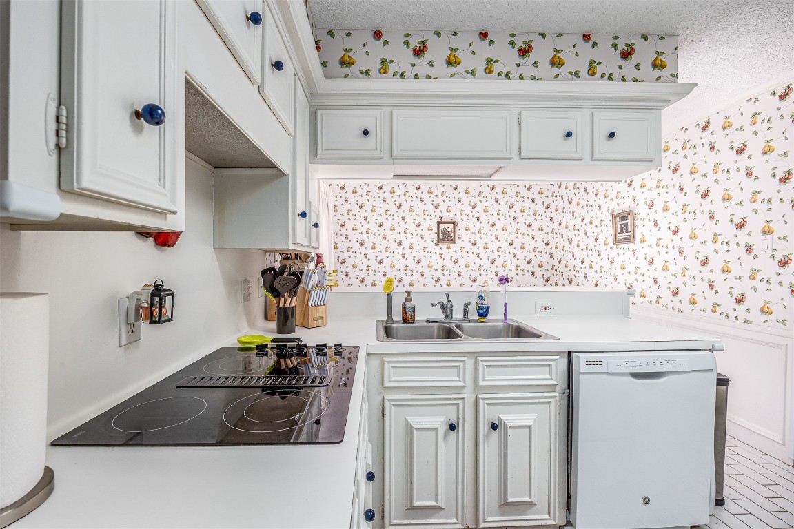 4613 Country Club View Baytown, TX 77521 - Photo 18 of 38 a kitchen with a sink stove and cabinets