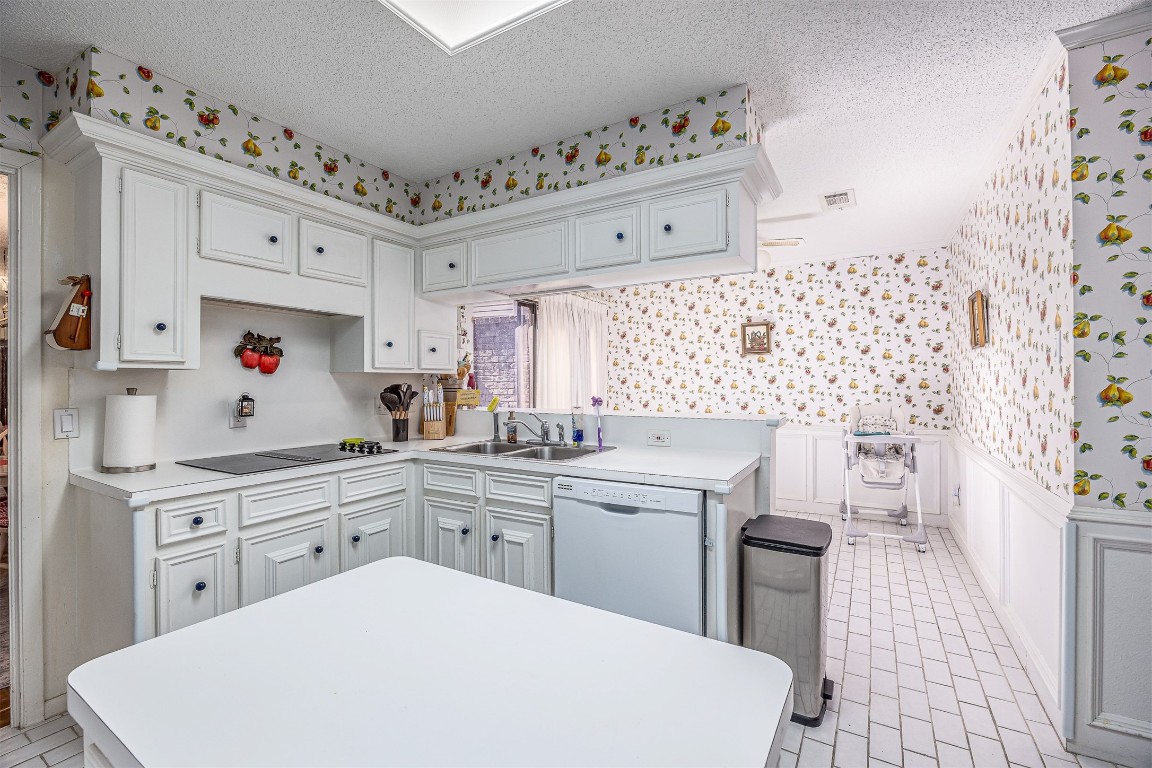 4613 Country Club View Baytown, TX 77521 - Photo 20 of 38 a kitchen with cabinets a sink and a stove