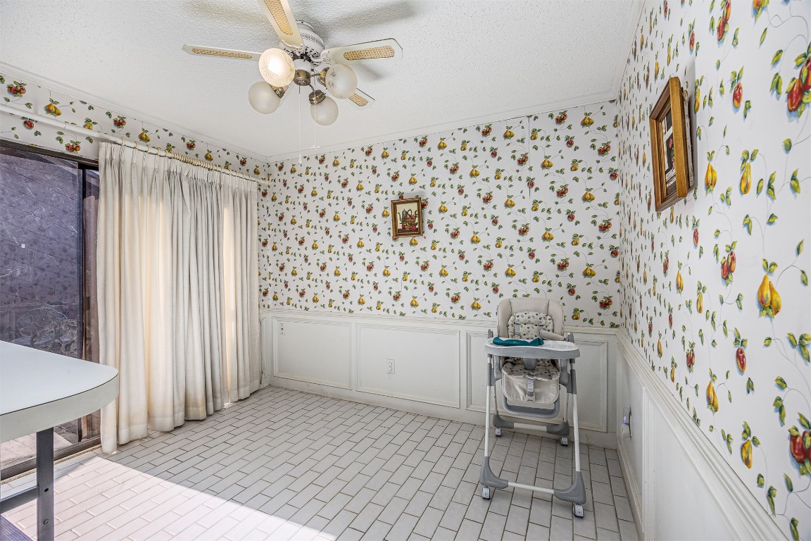4613 Country Club View Baytown, TX 77521 - Photo 21 of 38 a bathroom with a sink a chair and a painting on the wall