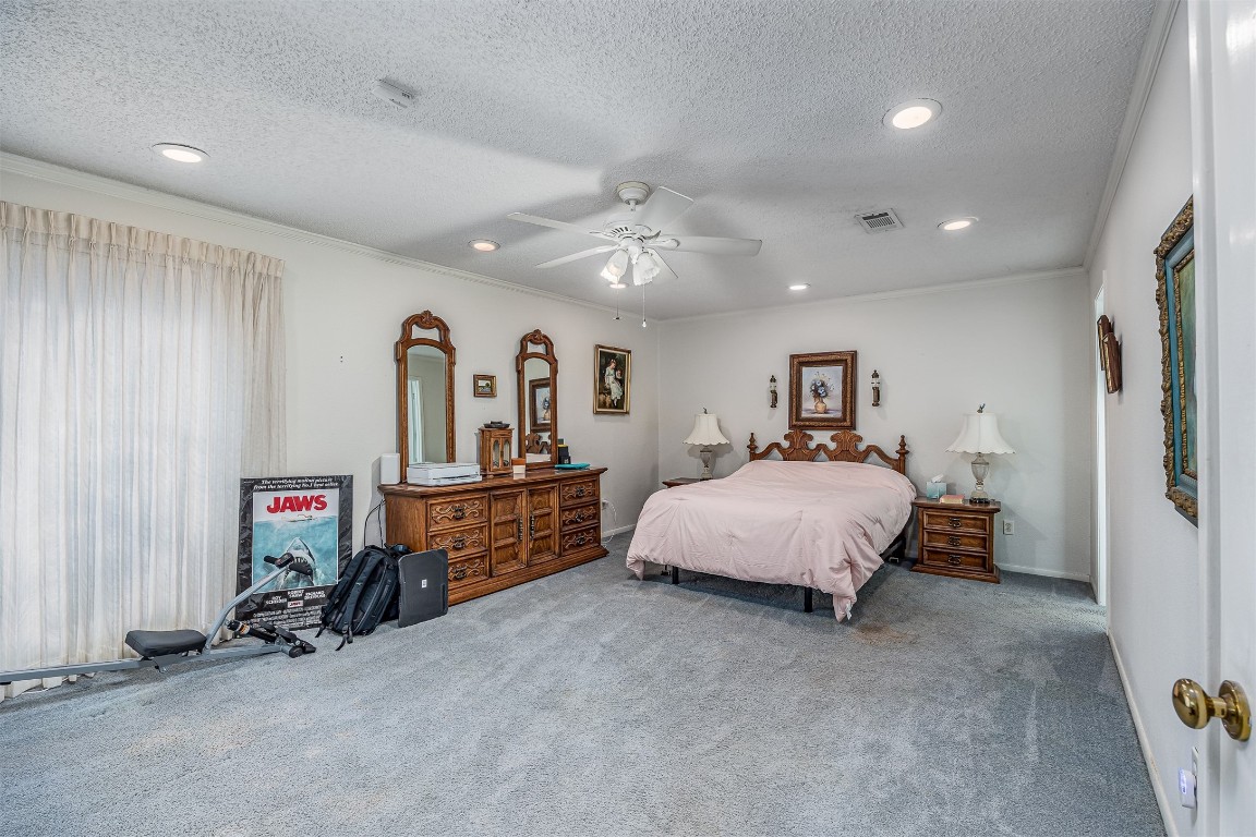 4613 Country Club View Baytown, TX 77521 - Photo 24 of 38 a bed room with a bed and a walk in closet