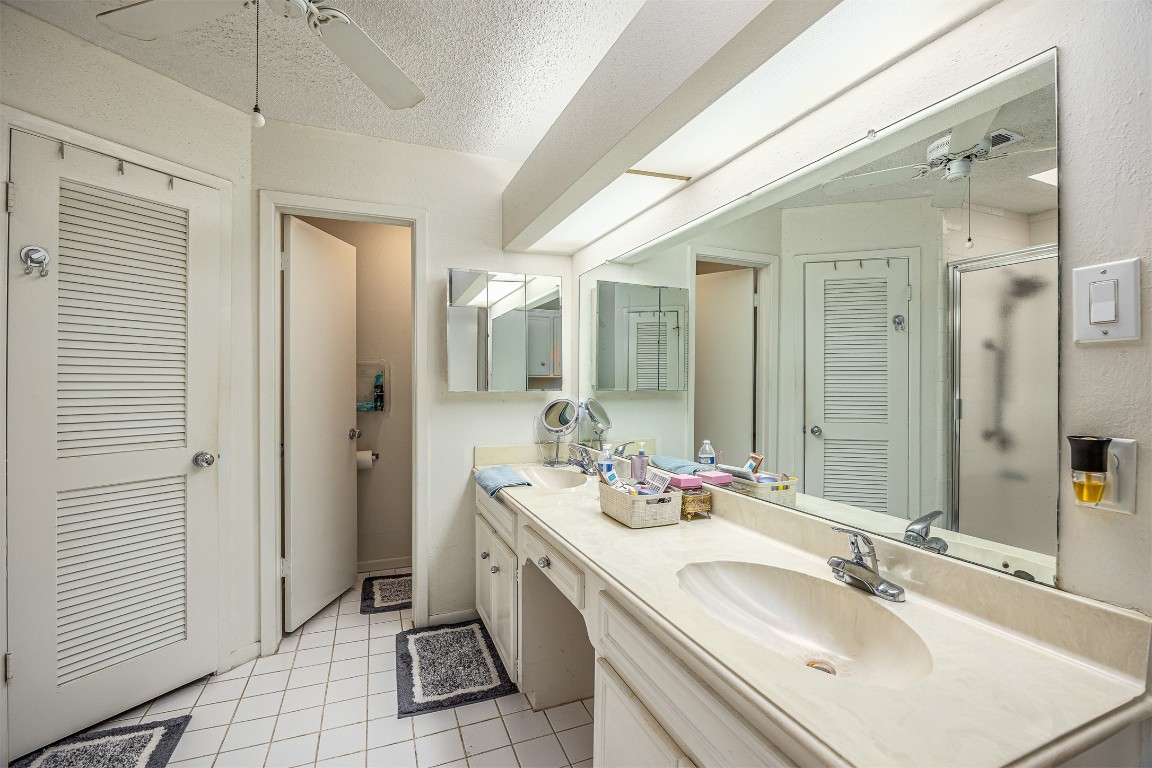 4613 Country Club View Baytown, TX 77521 - Photo 26 of 38 a bathroom with a sink double vanity and a mirror