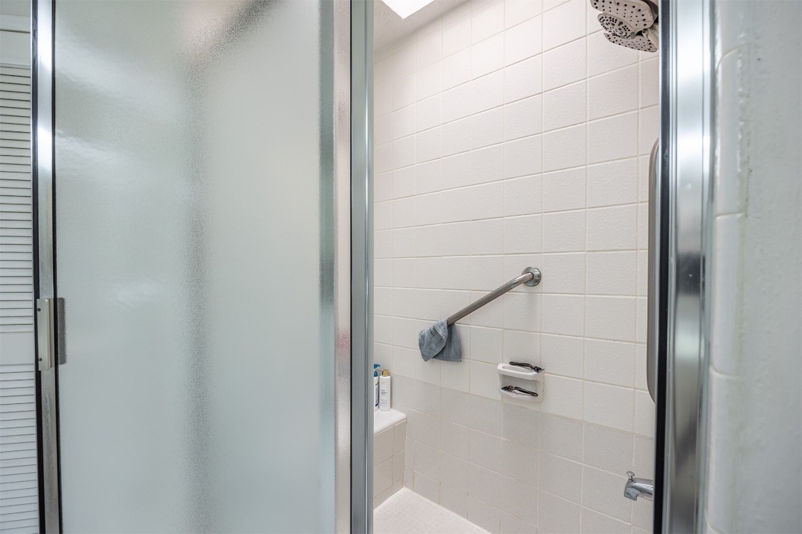 4613 Country Club View Baytown, TX 77521 - Photo 28 of 38 a bathroom with a glass shower door