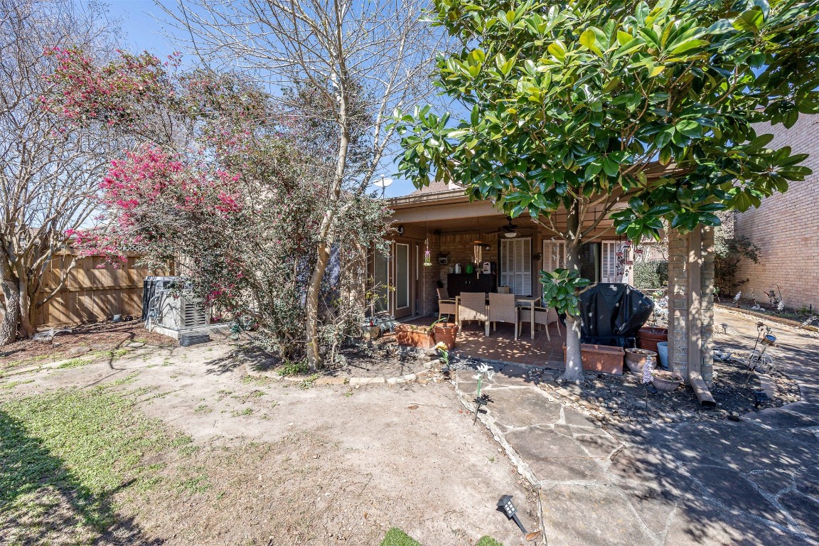 4613 Country Club View Baytown, TX 77521 - Photo 34 of 38 a view of a backyard with sitting area and furniture