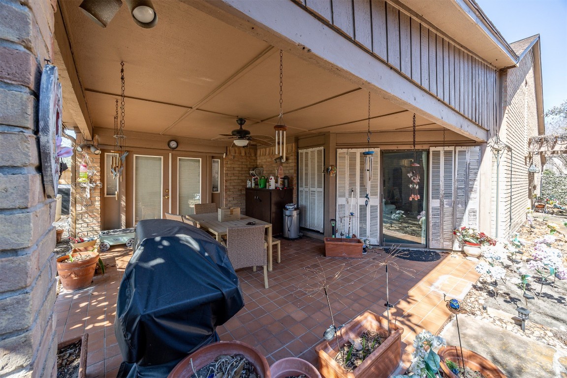 4613 Country Club View Baytown, TX 77521 - Photo 36 of 38 a view of a patio with table and chairs near a barn