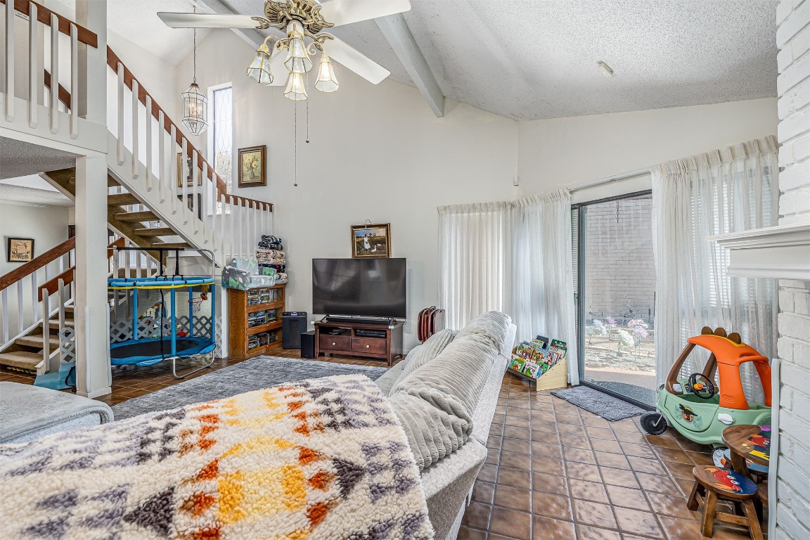 4613 Country Club View Baytown, TX 77521 - Photo 10 of 38 a living room with furniture a rug and a flat screen tv