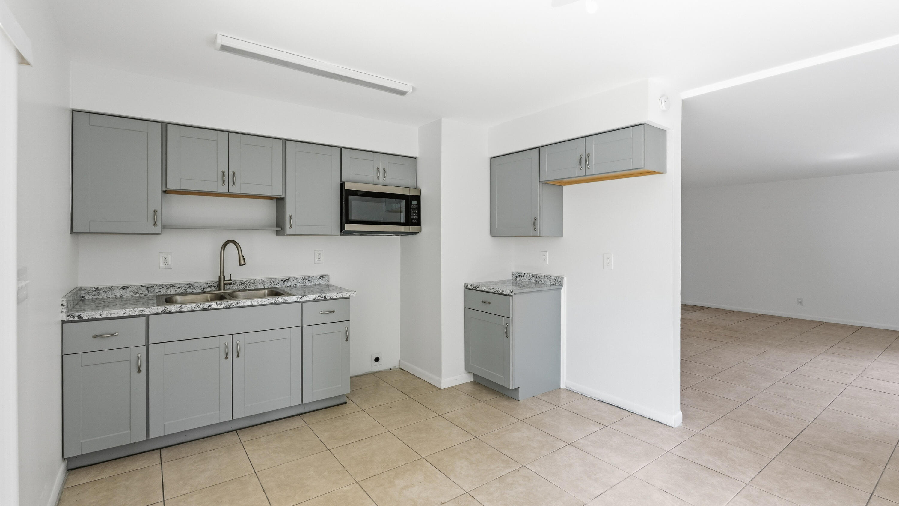 4453 Stevens Road Lake Worth Beach, FL 33461 - Photo 45 of 67 a kitchen with sink and cabinets