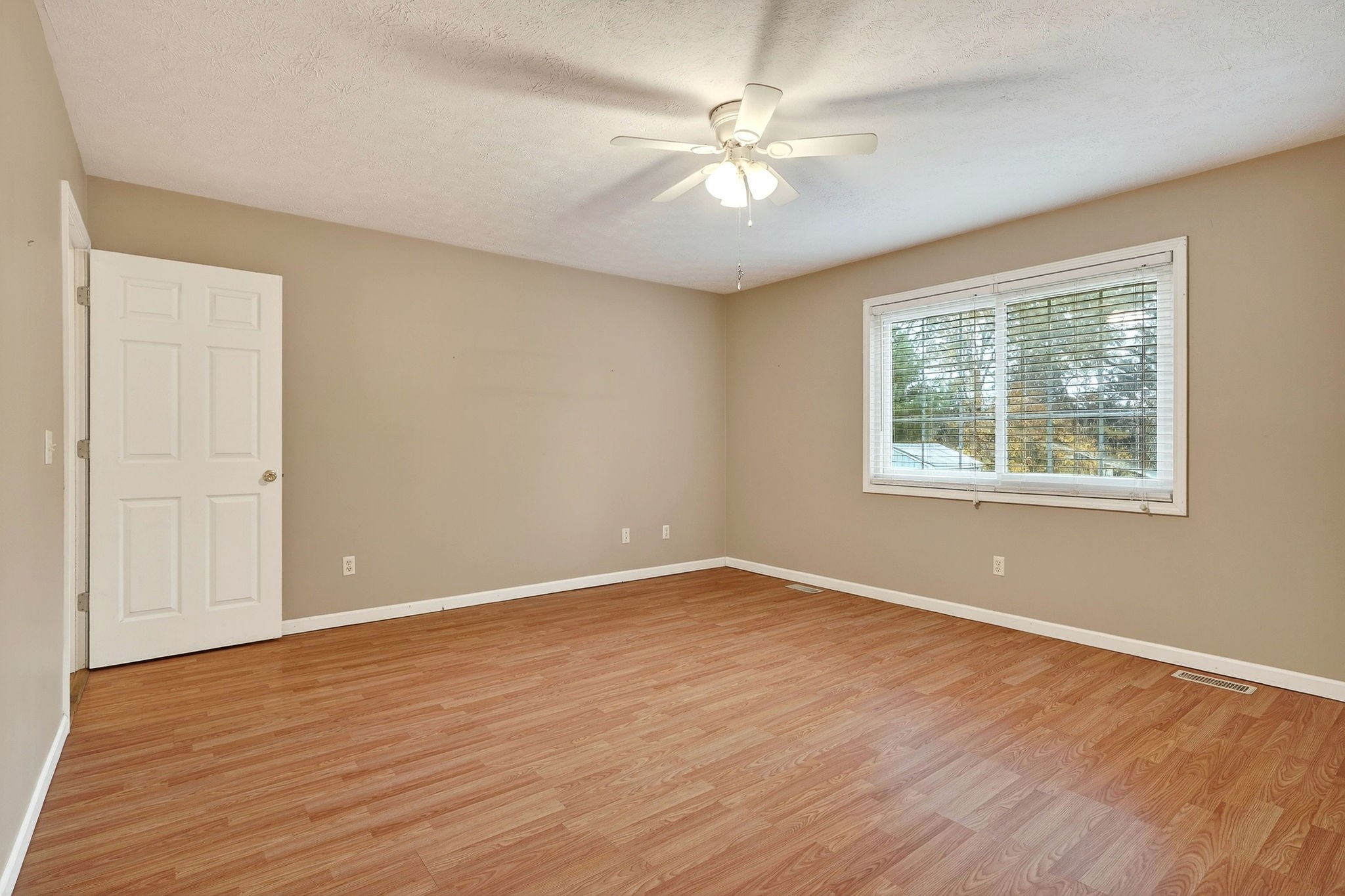 311 Poplar Point Lane Rickman, TN 38580 - Photo 16 of 36 a view of an empty room with wooden floor and a window