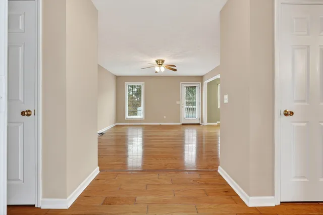 a view of a hallway with windows