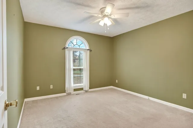 an empty room with a bathroom