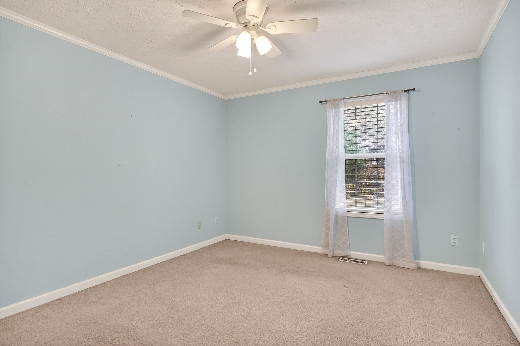 311 Poplar Point Lane Rickman, TN 38580 - Photo 24 of 36 an empty room with a window and a ceiling fan