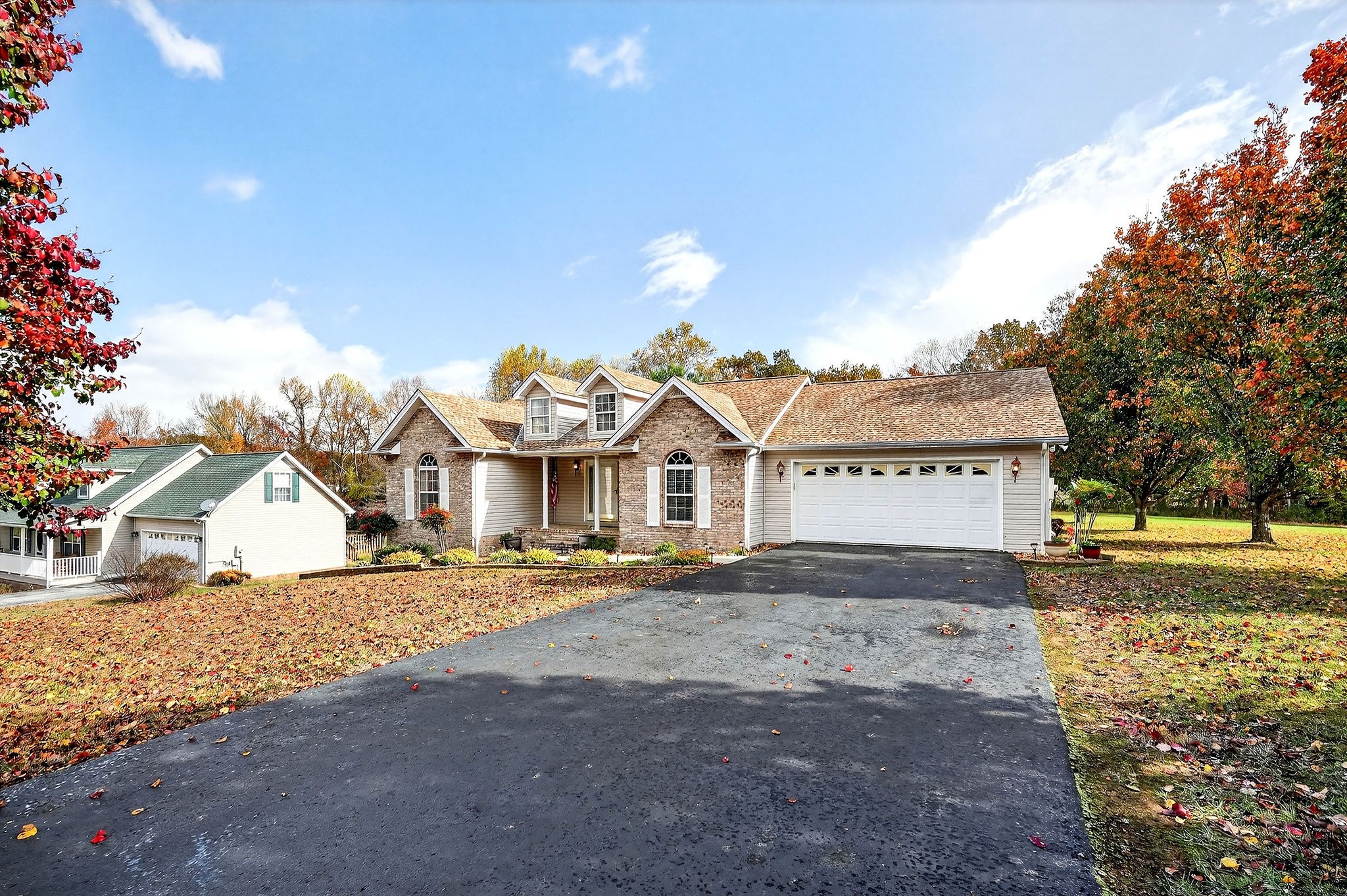 311 Poplar Point Lane Rickman, TN 38580 - Photo 35 of 36 a front view of a house with a yard and garage