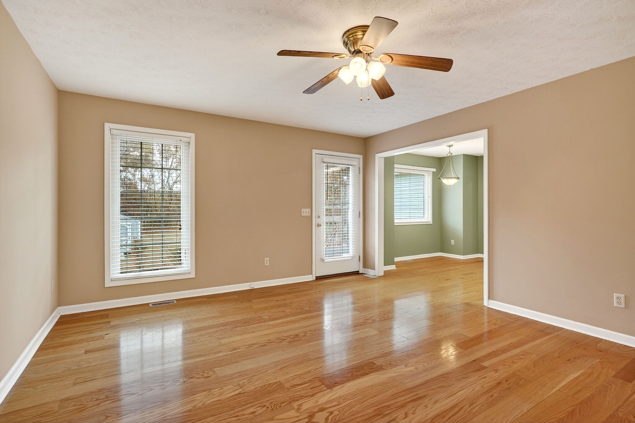 311 Poplar Point Lane Rickman, TN 38580 - Photo 4 of 36 a view of an empty room with a window and wooden floor