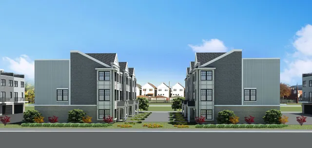 a city street lined with buildings and trees