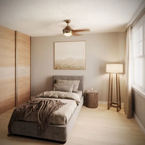 a bedroom with a bed and a chandelier