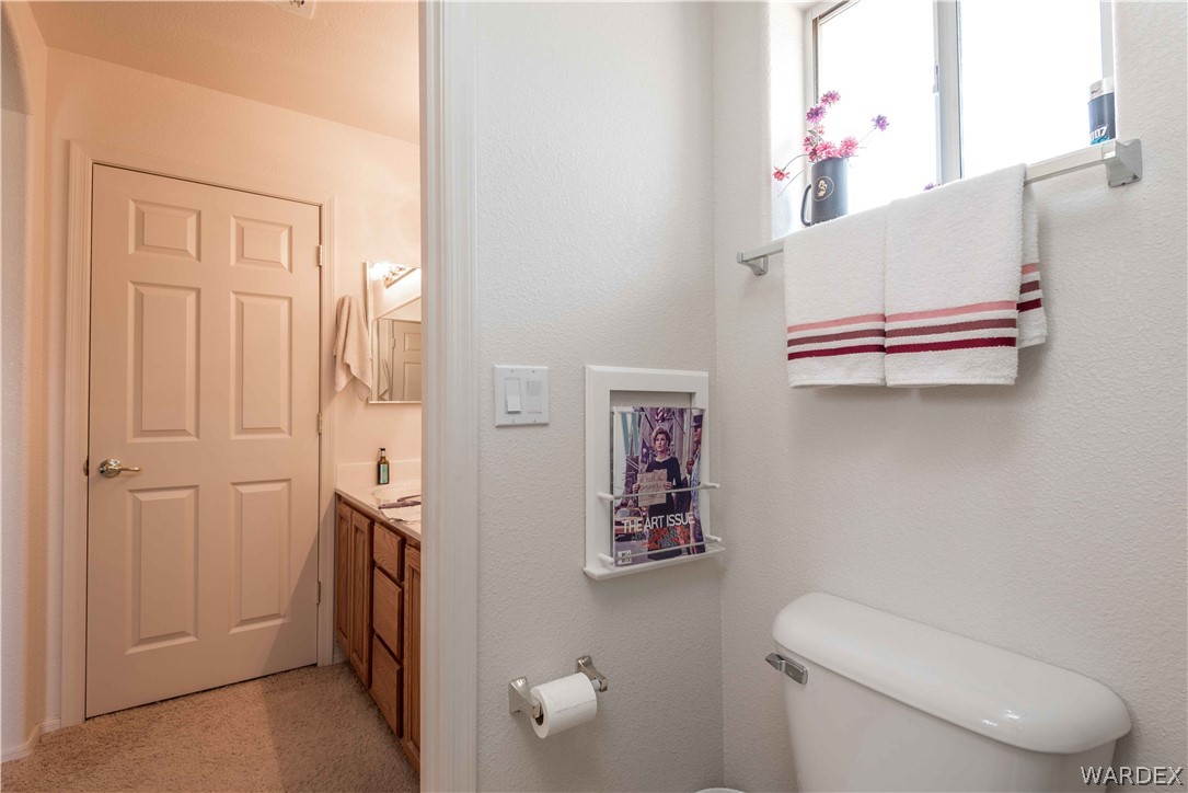 4305 East Cane Ranch Road Kingman, AZ 86401 - Photo 18 of 38 a bathroom with a toilet and a shower