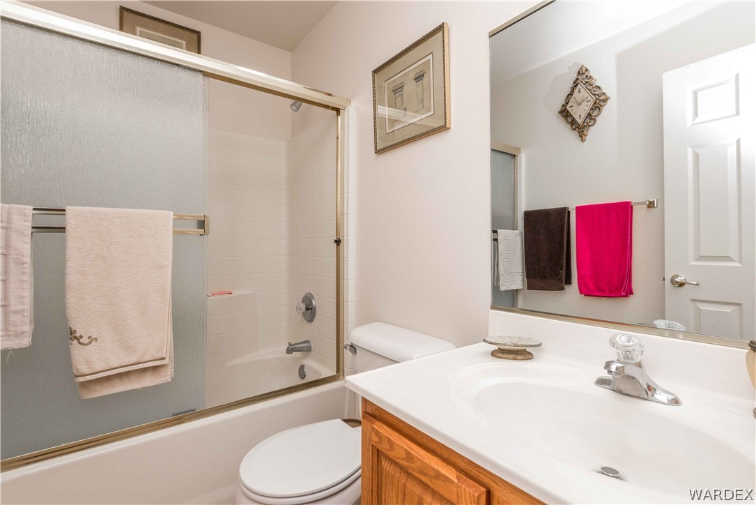 4305 East Cane Ranch Road Kingman, AZ 86401 - Photo 23 of 38 a bathroom with a sink vanity mirror and toilet