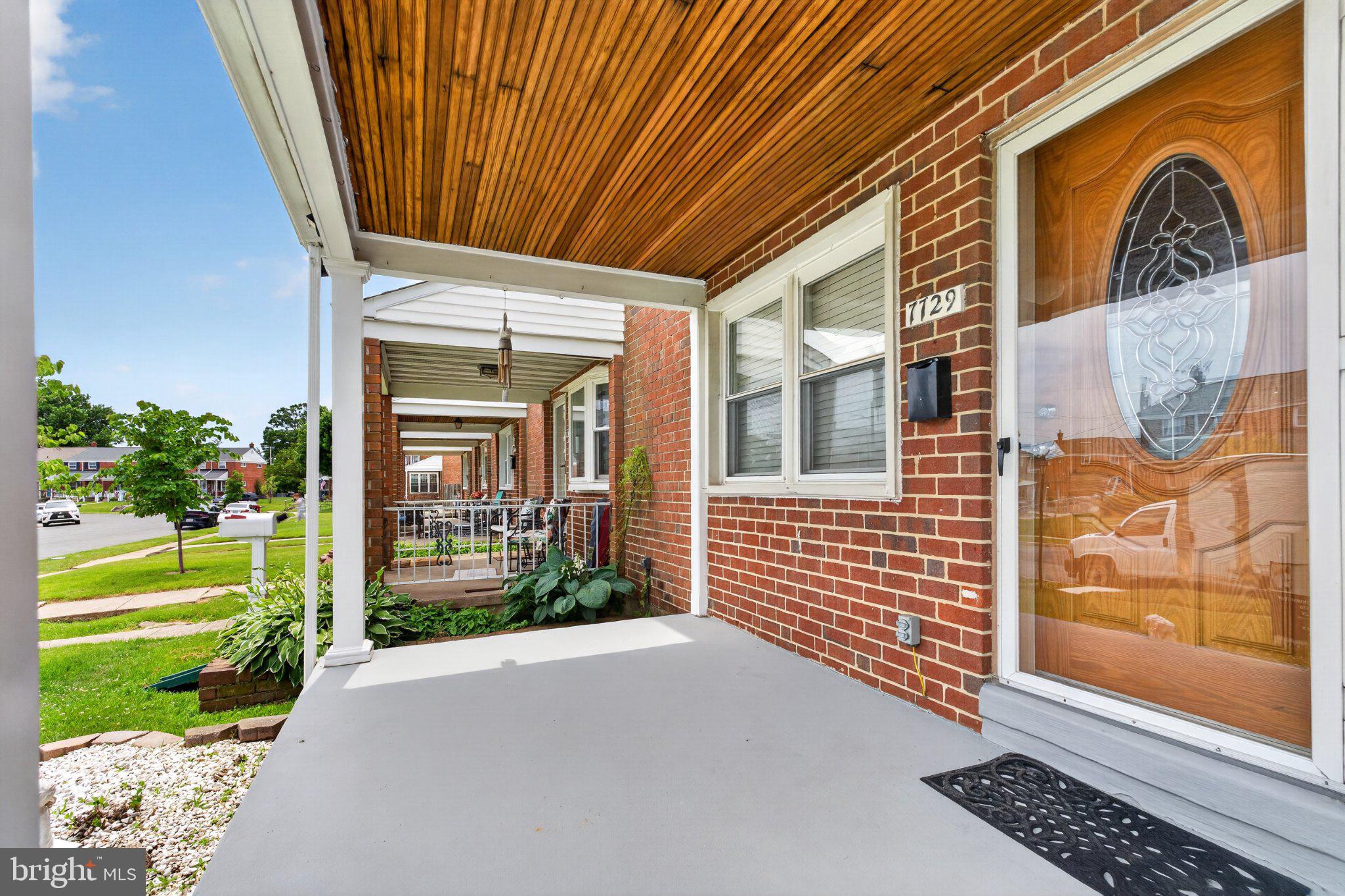 7729 Charlesmont Road Baltimore, MD 21222 - Photo 2 of 38 Charming porch with inviting entryway.