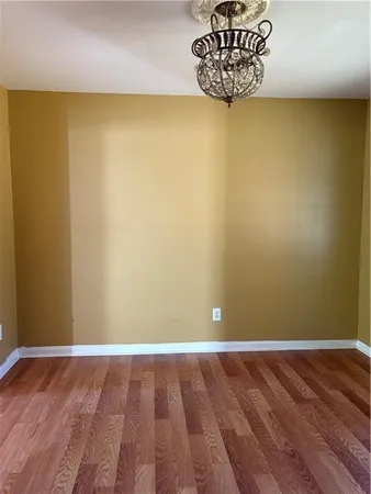 a view of a small space with wooden floor