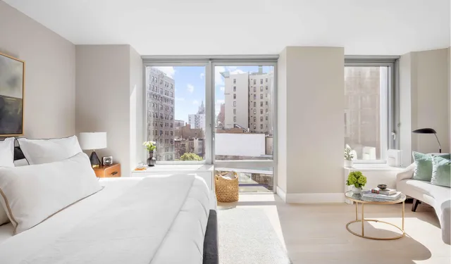 a view of a bathroom with a tub sink and mirror