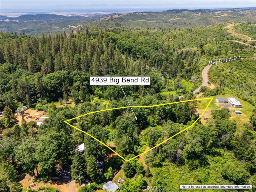 4939 Big Bend Road Oroville, CA 95965 - Photo 11 of 16 a view of a field with a tree in the background
