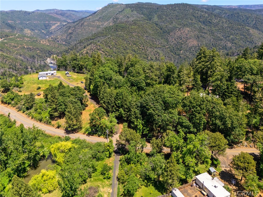 4939 Big Bend Road Oroville, CA 95965 - Photo 14 of 16 an aerial view of houses covered in trees
