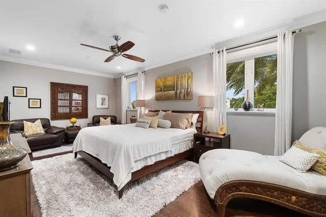 a bedroom with double bed and a window