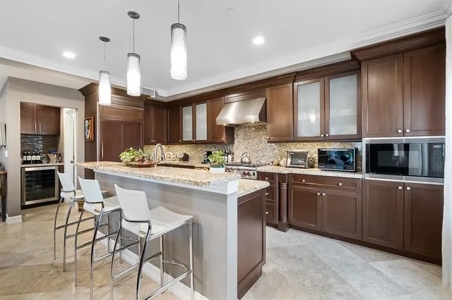 a kitchen with a sink cabinets and window