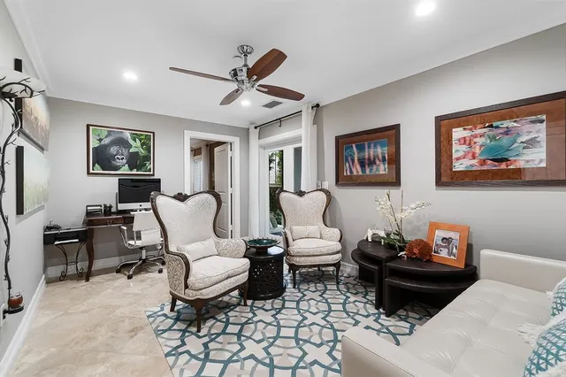 a living room with furniture a rug and a window
