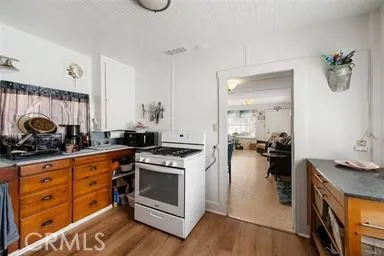a kitchen with a stove and a sink