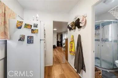 a bedroom with furniture and wooden floor