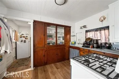 a kitchen with stainless steel appliances granite countertop a stove and a refrigerator
