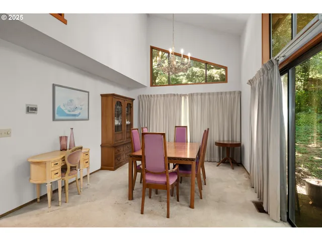 a view of a dining room with furniture and window