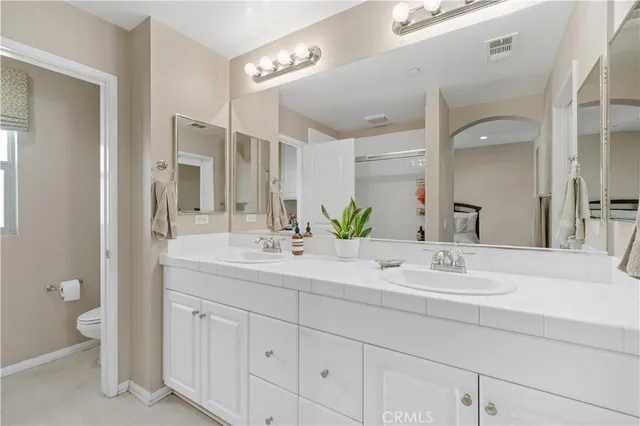 a bedroom with a bed and with window